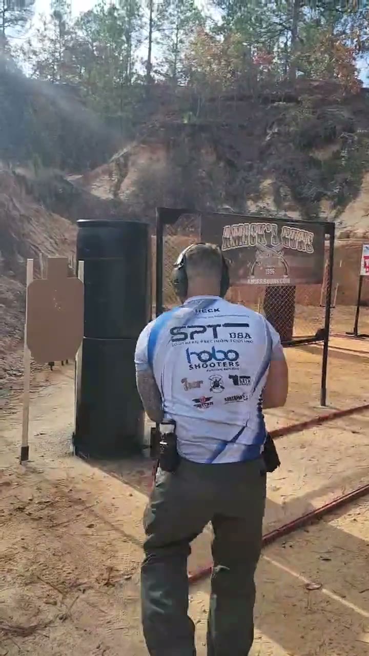 Team shooter in the HOBO Shooters jersey moving between barrels on a stage